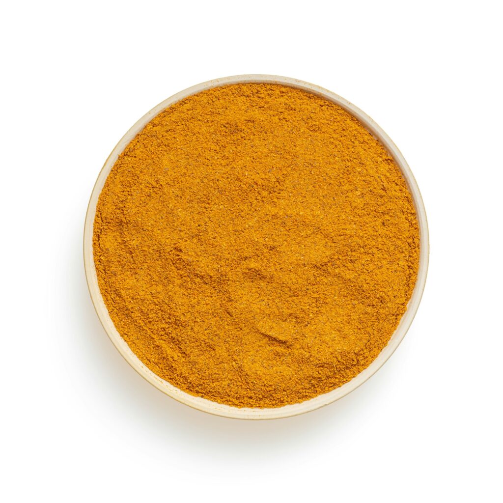 Bowl of fine, bright high-curcumin turmeric powder